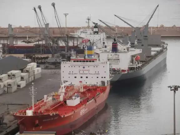 Global B2B trade marketplace - cargo ships and containers at international export import port | EximNext